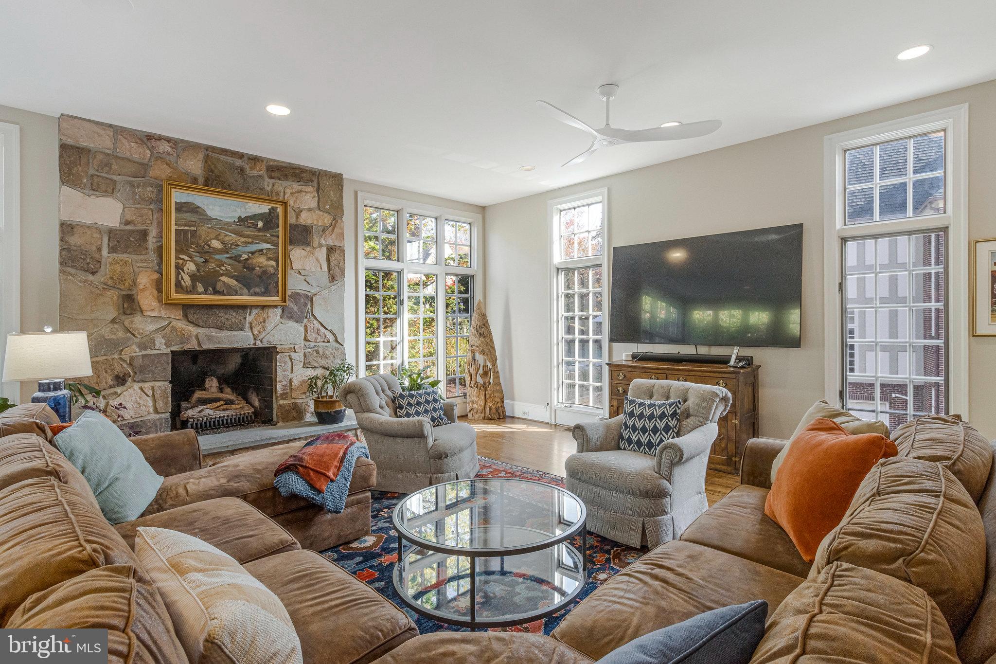 1655 Kalmia Road Northwest Washington, DC 20012 - Photo 21 of 71 a living room with furniture a flat screen tv and a large window