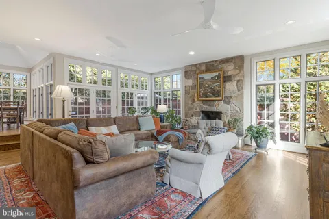 a view of entryway livingroom and hall with wooden floor