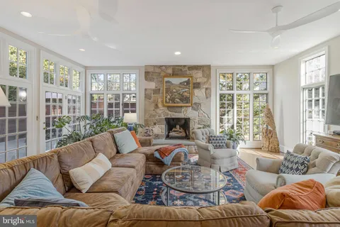 a view of staircase with white walls and a window