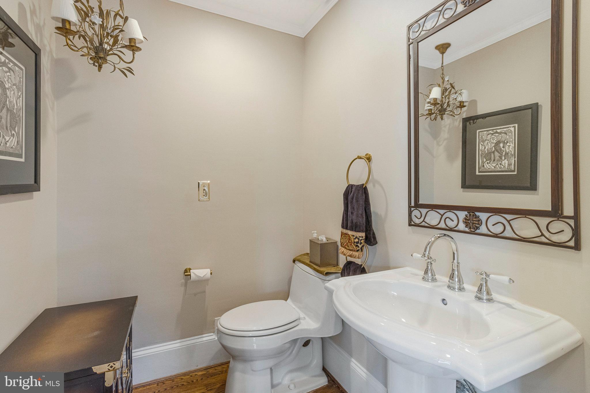 1655 Kalmia Road Northwest Washington, DC 20012 - Photo 28 of 71 a bathroom with a toilet a sink and mirror