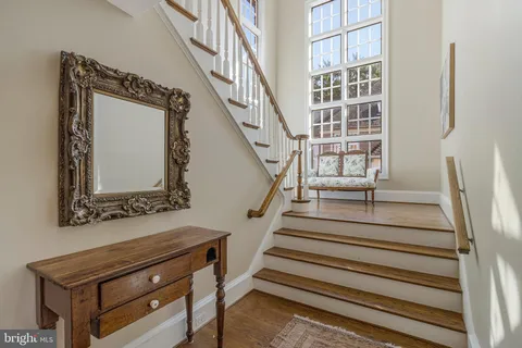 a spacious bathroom with double vanity a sink a mirror a bathtub and shower