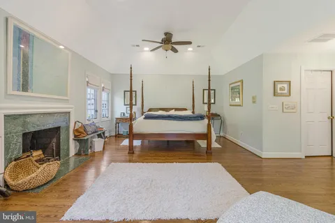 a bedroom with two beds and a window