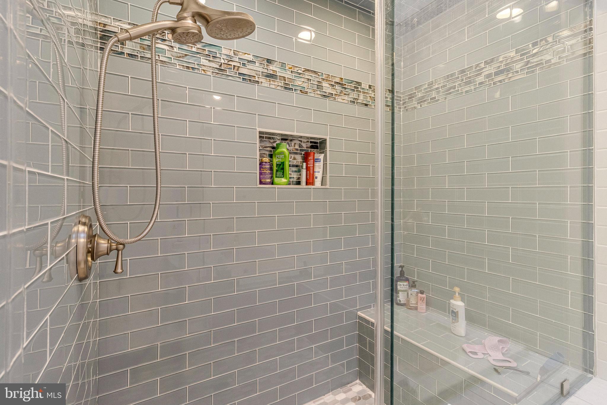 1655 Kalmia Road Northwest Washington, DC 20012 - Photo 38 of 71 Sleek modern shower with elegant tile design.