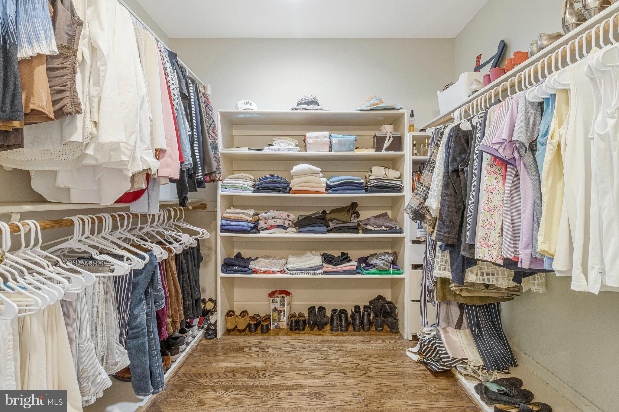 1655 Kalmia Road Northwest Washington, DC 20012 - Photo 42 of 71 a view of walk in closet with clothes and shoes