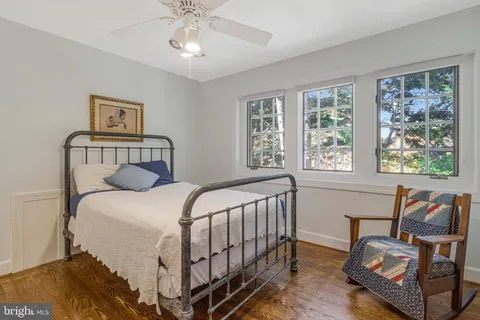 a bedroom with a bed and a couch