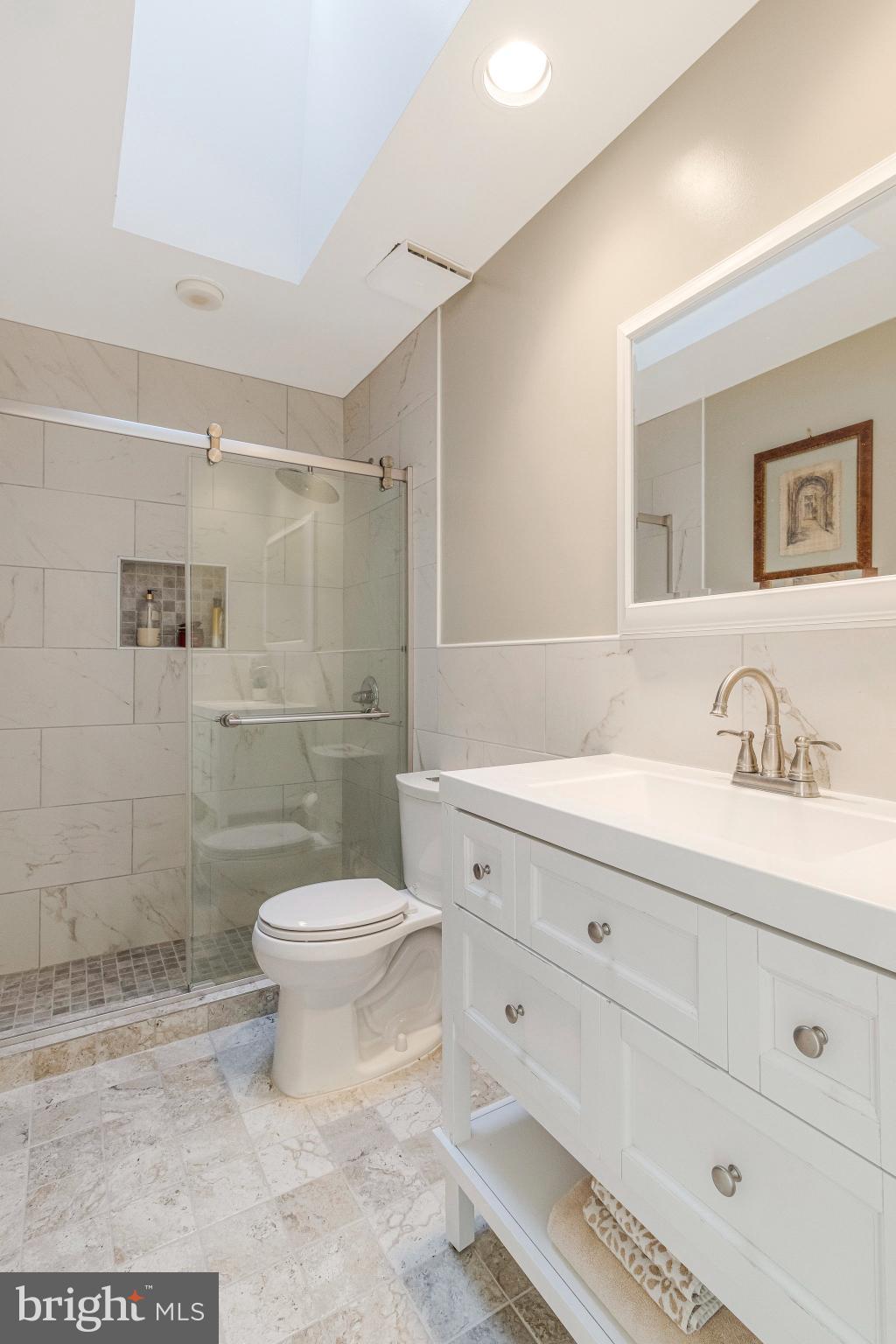 1655 Kalmia Road Northwest Washington, DC 20012 - Photo 46 of 71 a bathroom with a sink a toilet and shower