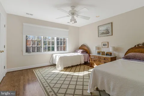 a view of a patio with a table and chairs under an umbrella