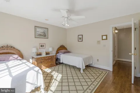 a view of a patio with table and chairs under an umbrella