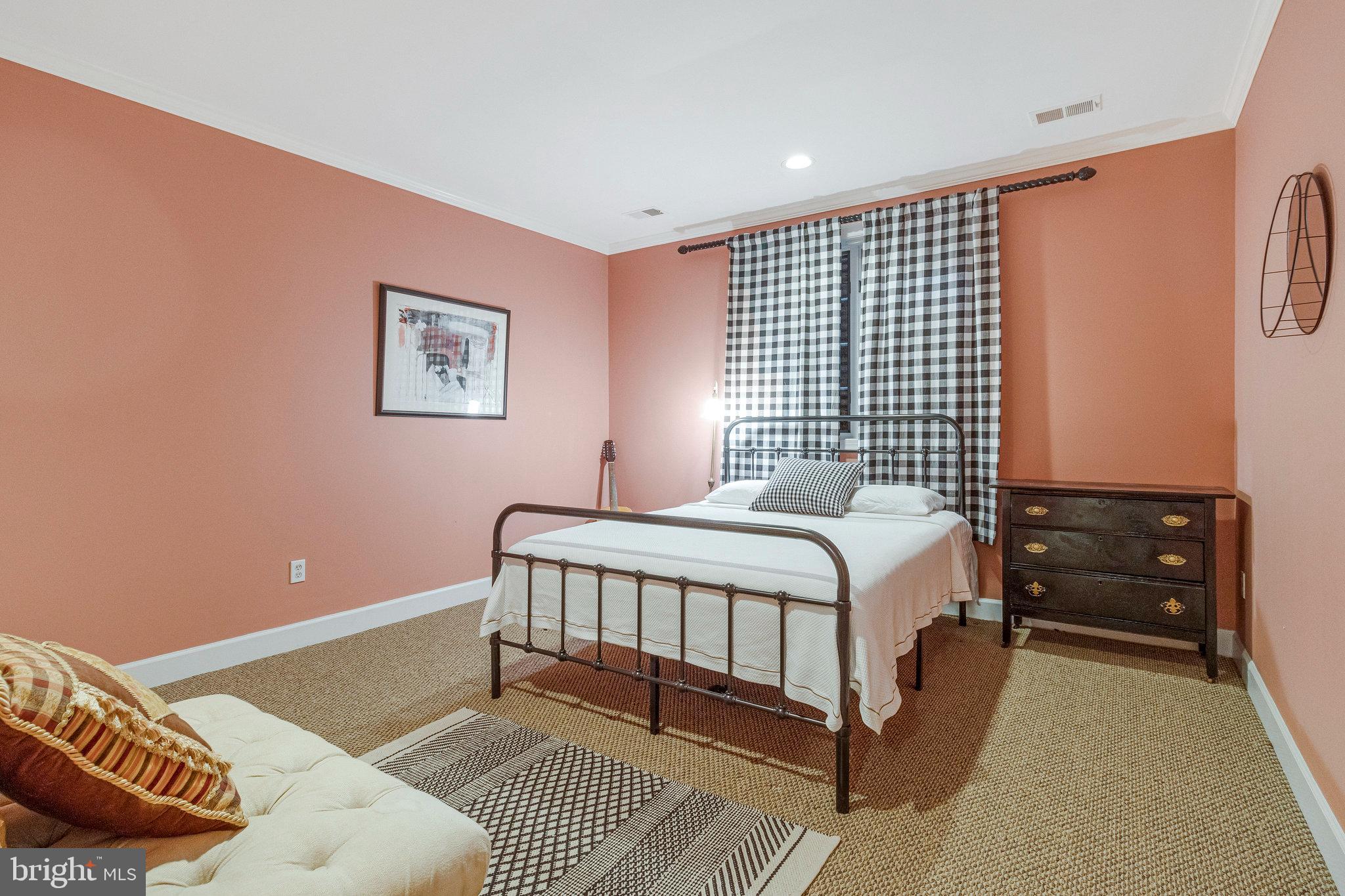 1655 Kalmia Road Northwest Washington, DC 20012 - Photo 62 of 71 a bedroom with a bed and dresser with the outer view