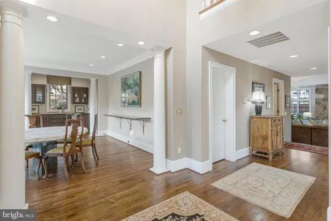 a kitchen with granite countertop a sink stove and cabinets
