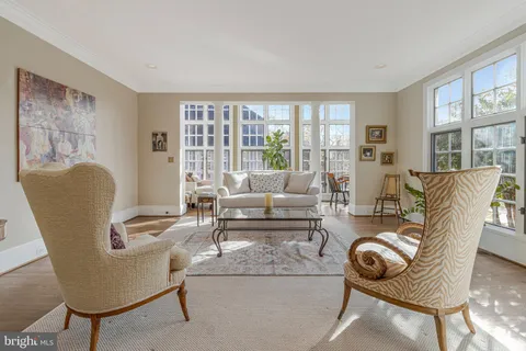 a kitchen with stainless steel appliances granite countertop a sink refrigerator and cabinets