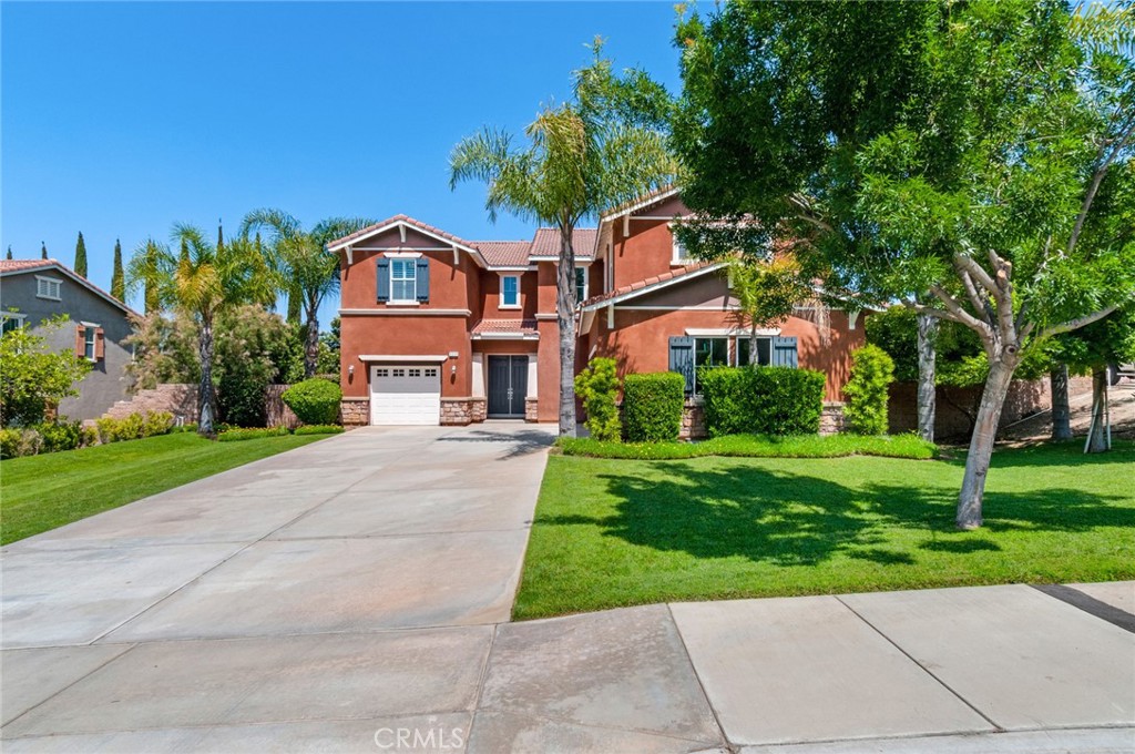 9328 Grangehill Drive Riverside, CA 92508 - Photo 1 of 1 a front view of house with yard and green space