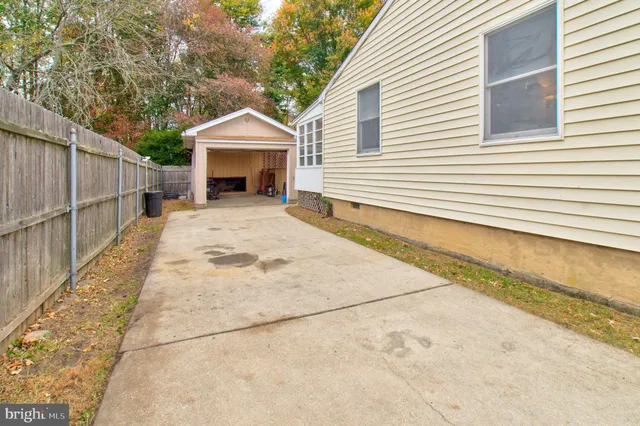 a view of a house with a yard and garage