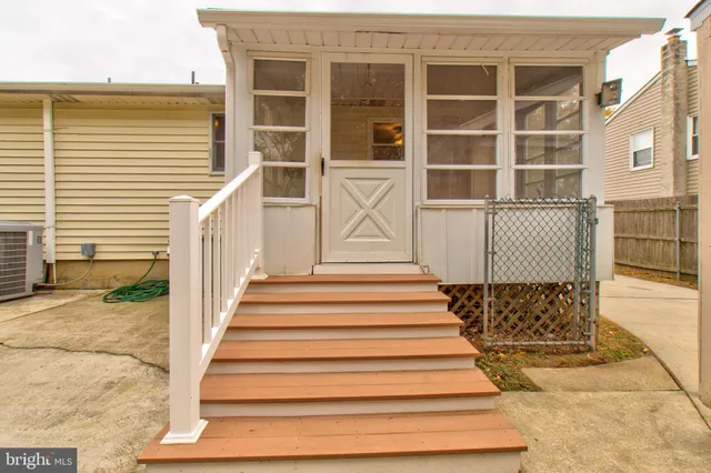 a view of a wooden door and a yard