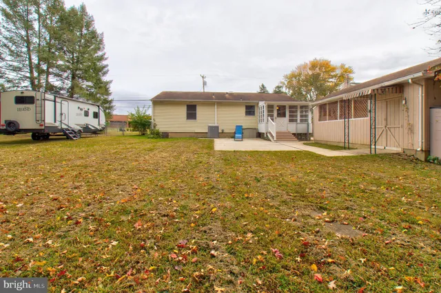 a front view of house with yard and seating area