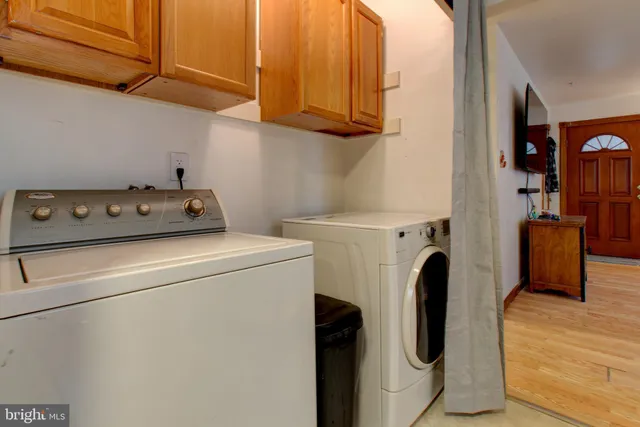 a view of hallway with wooden floor