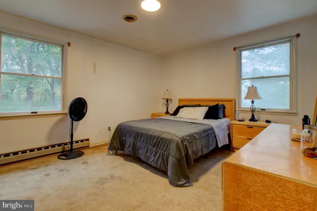 a bedroom with a bed and cabinets
