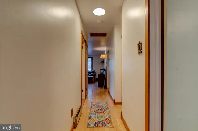 a view of a house with lounge chair and wooden floor