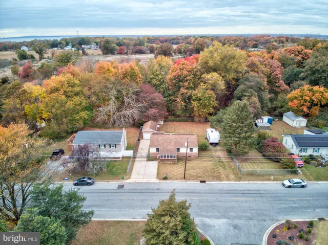 an aerial view of a house with a ocean view