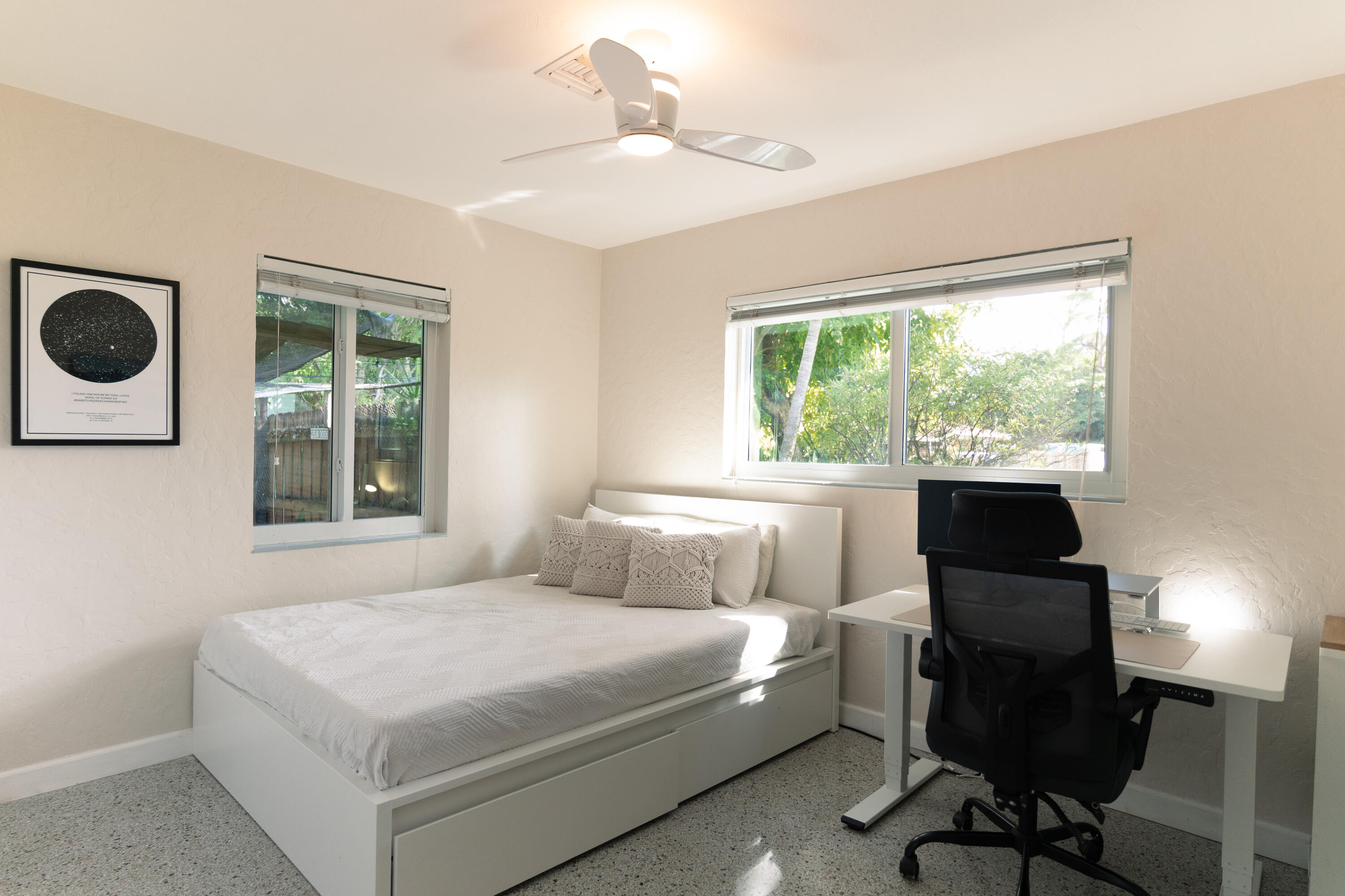 5155 Cleveland Road Delray Beach, FL 33484 - Photo 16 of 40 a bedroom with a bed window and a desk