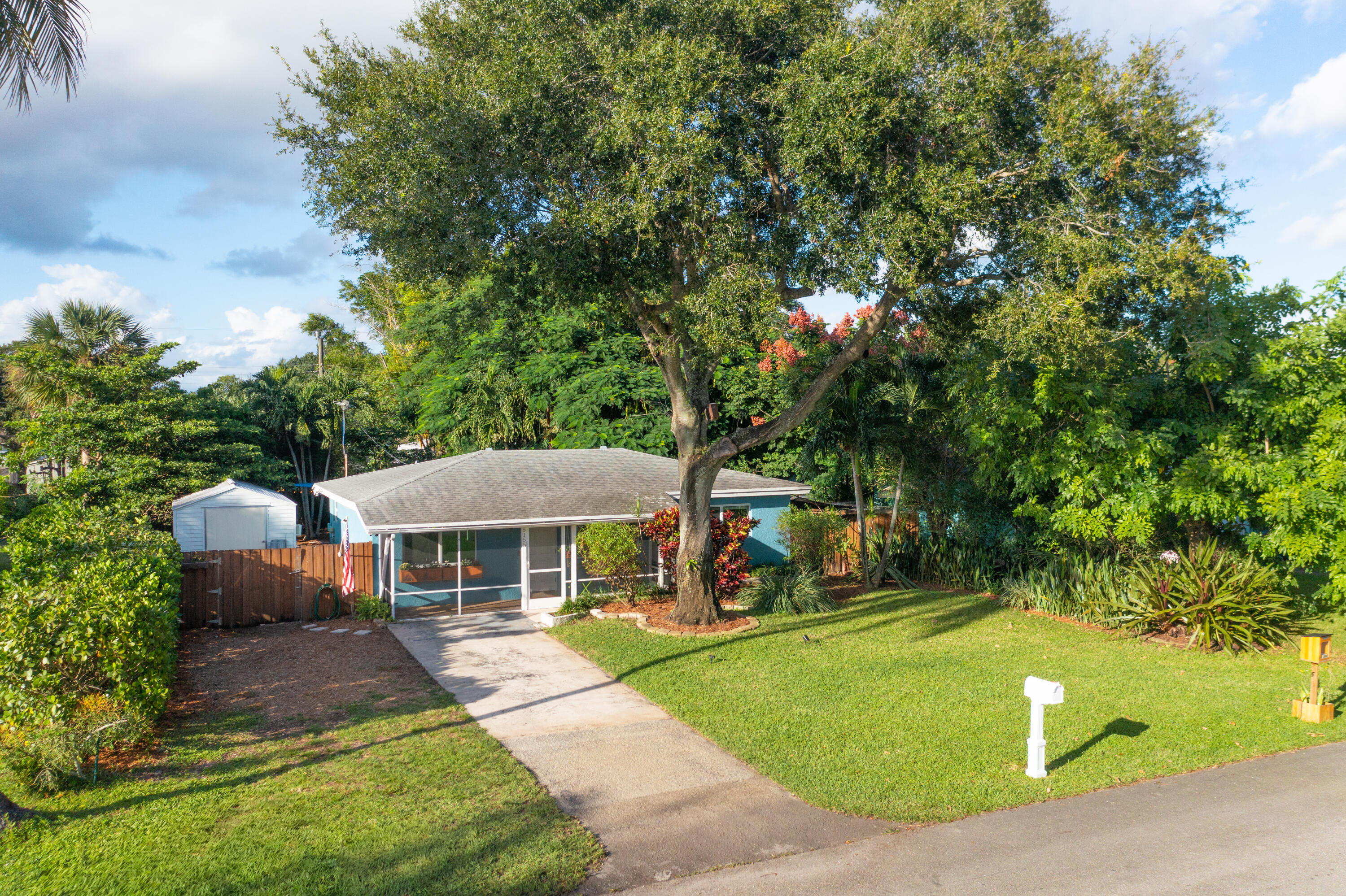 5155 Cleveland Road Delray Beach, FL 33484 - Photo 2 of 40 a view of house with a yard