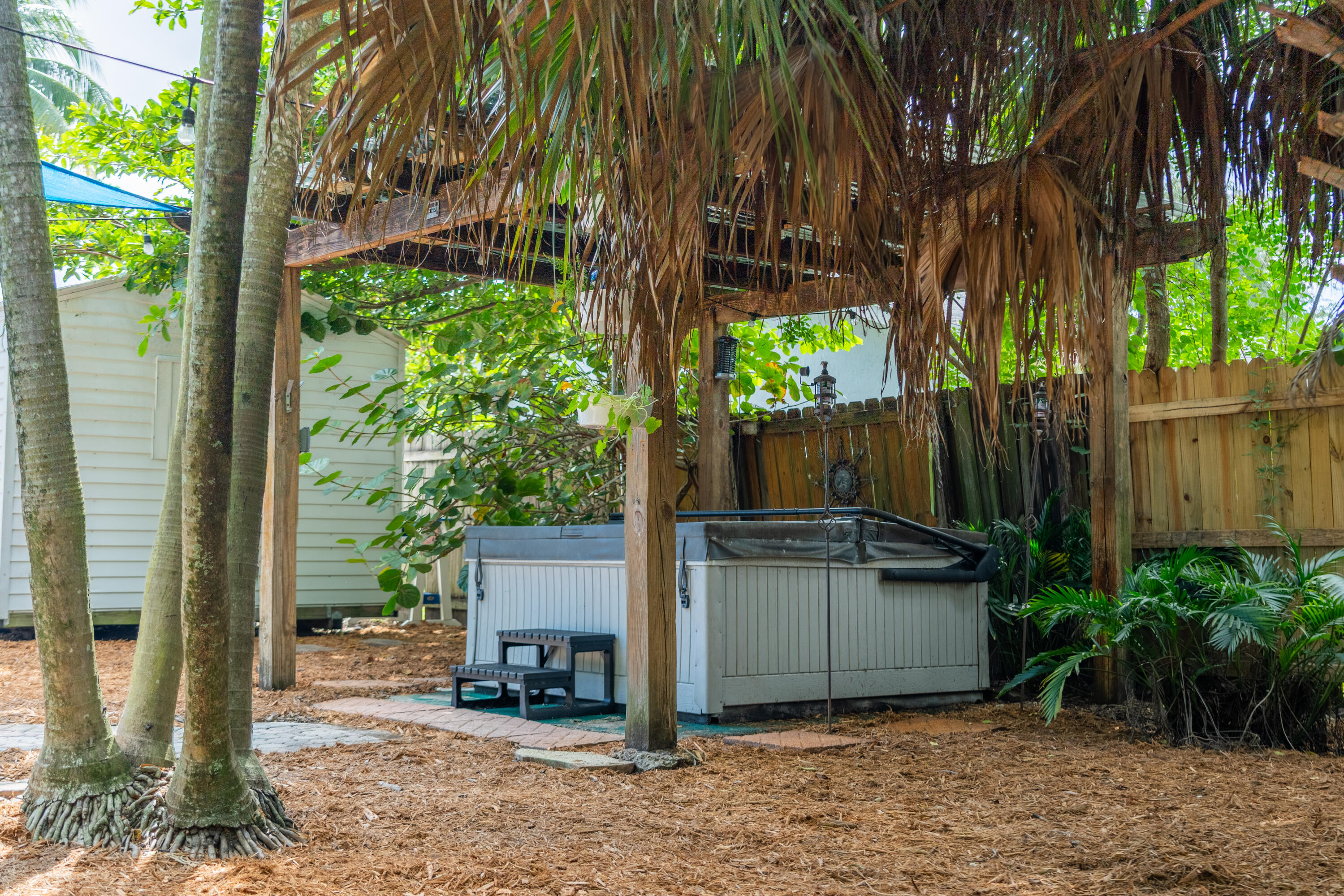 5155 Cleveland Road Delray Beach, FL 33484 - Photo 29 of 40 a backyard of a house with seating space