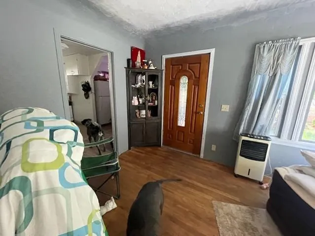 a bedroom with bed and a window