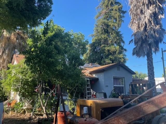 220 Little Avenue Gridley, CA 95948 - Photo 3 of 17 a view of a patio with couches table and chairs and potted plants