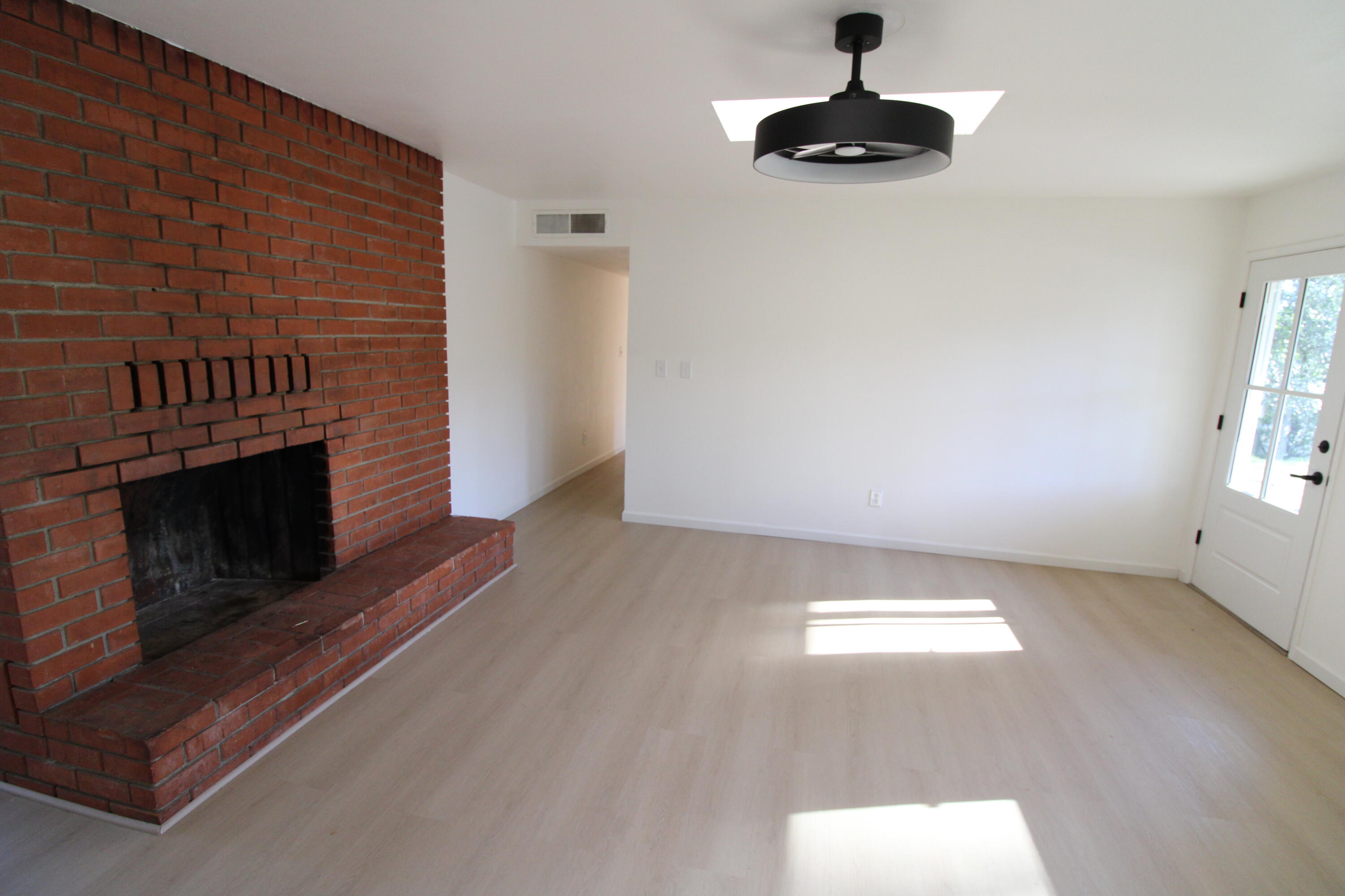 3170 Quartz Hill Road Redding, CA 96003 - Photo 18 of 68 wooden floor in an empty room with a fireplace