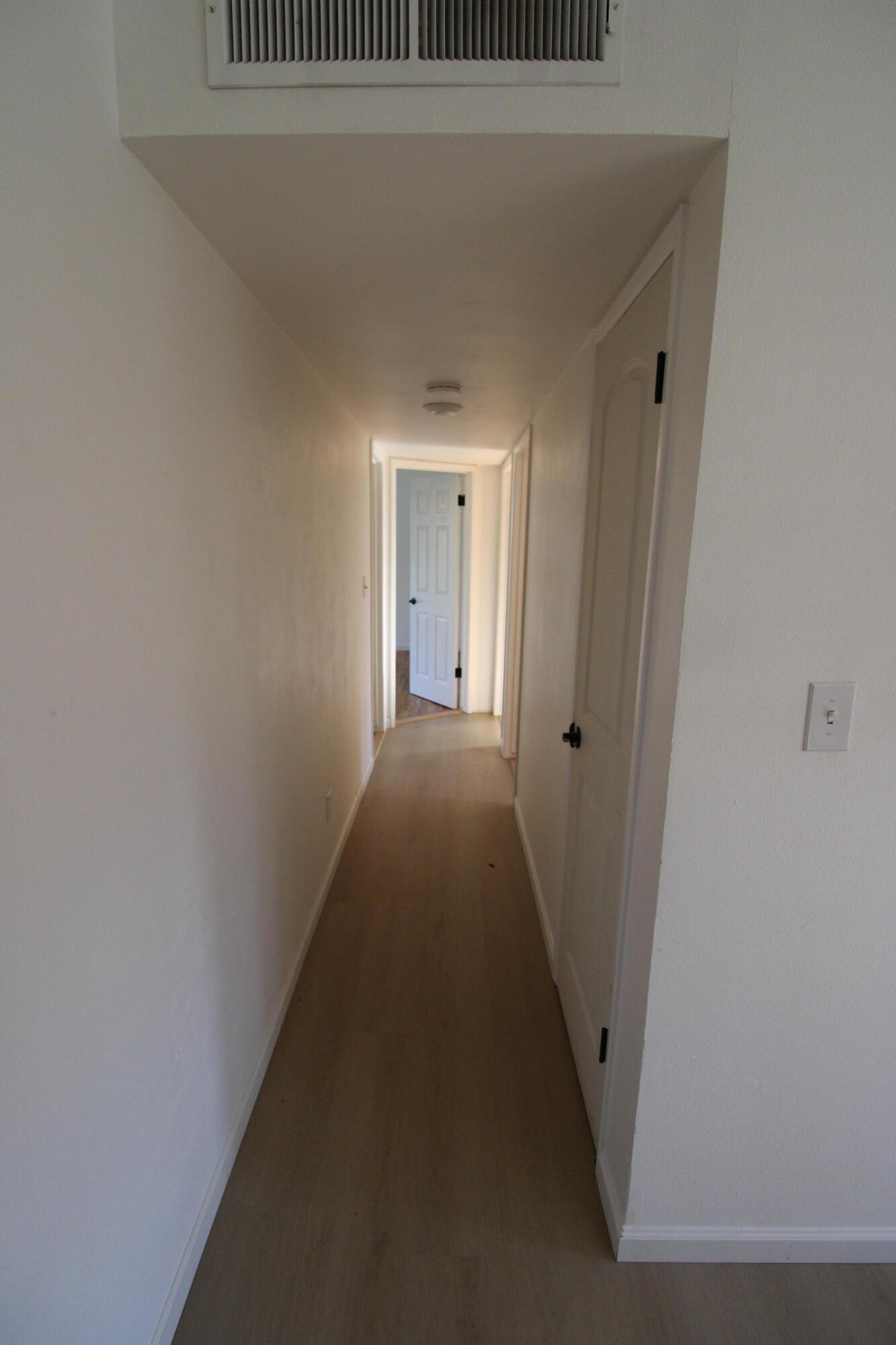 3170 Quartz Hill Road Redding, CA 96003 - Photo 20 of 68 a view of a hallway with wooden floor