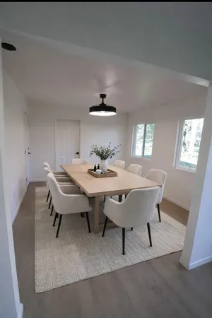a view of a bedroom with wooden floor and bedroom