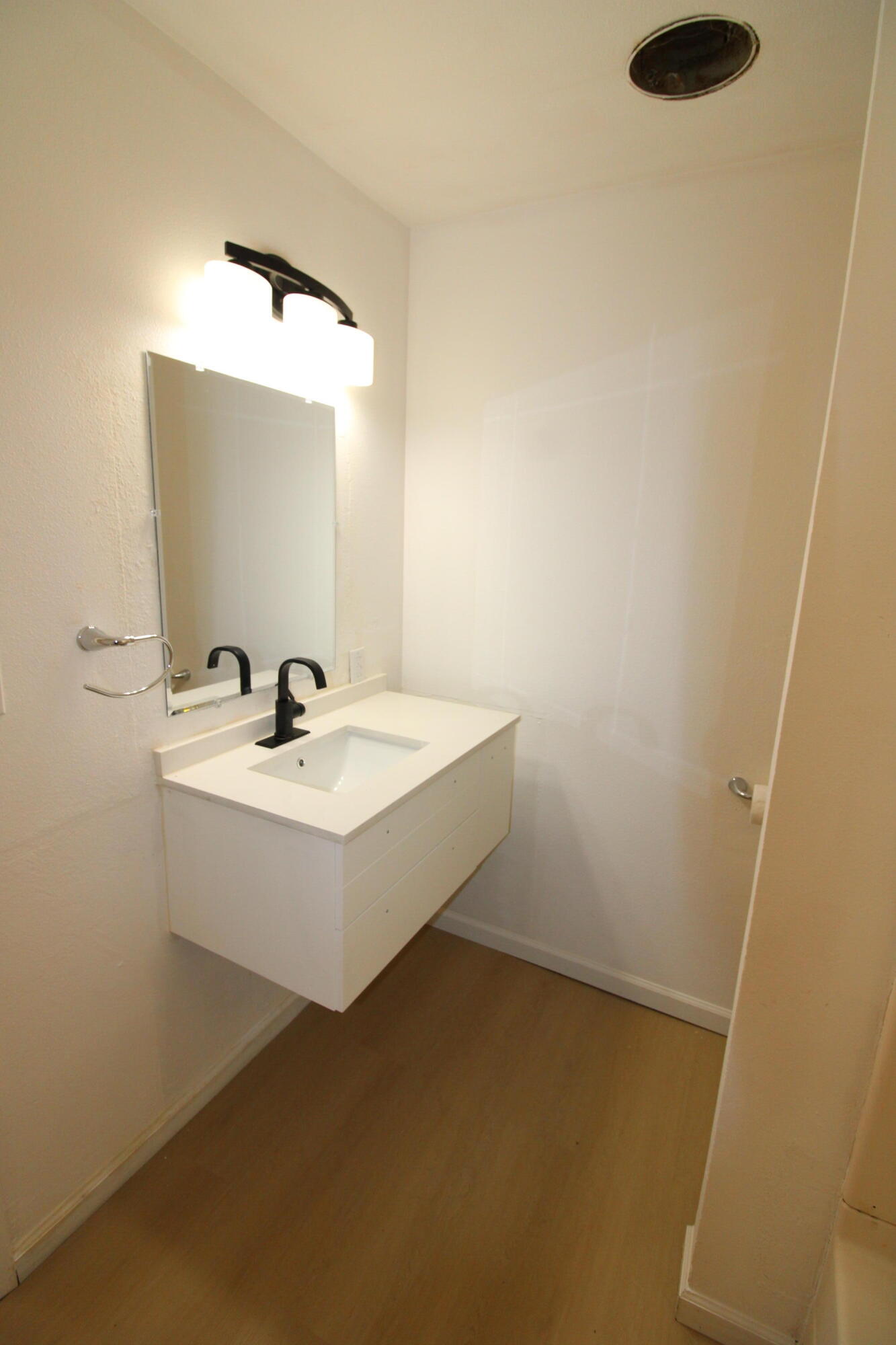 3170 Quartz Hill Road Redding, CA 96003 - Photo 28 of 68 a white bathroom with a sink and a mirror