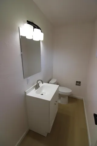 a room with a sink cabinets and utility room