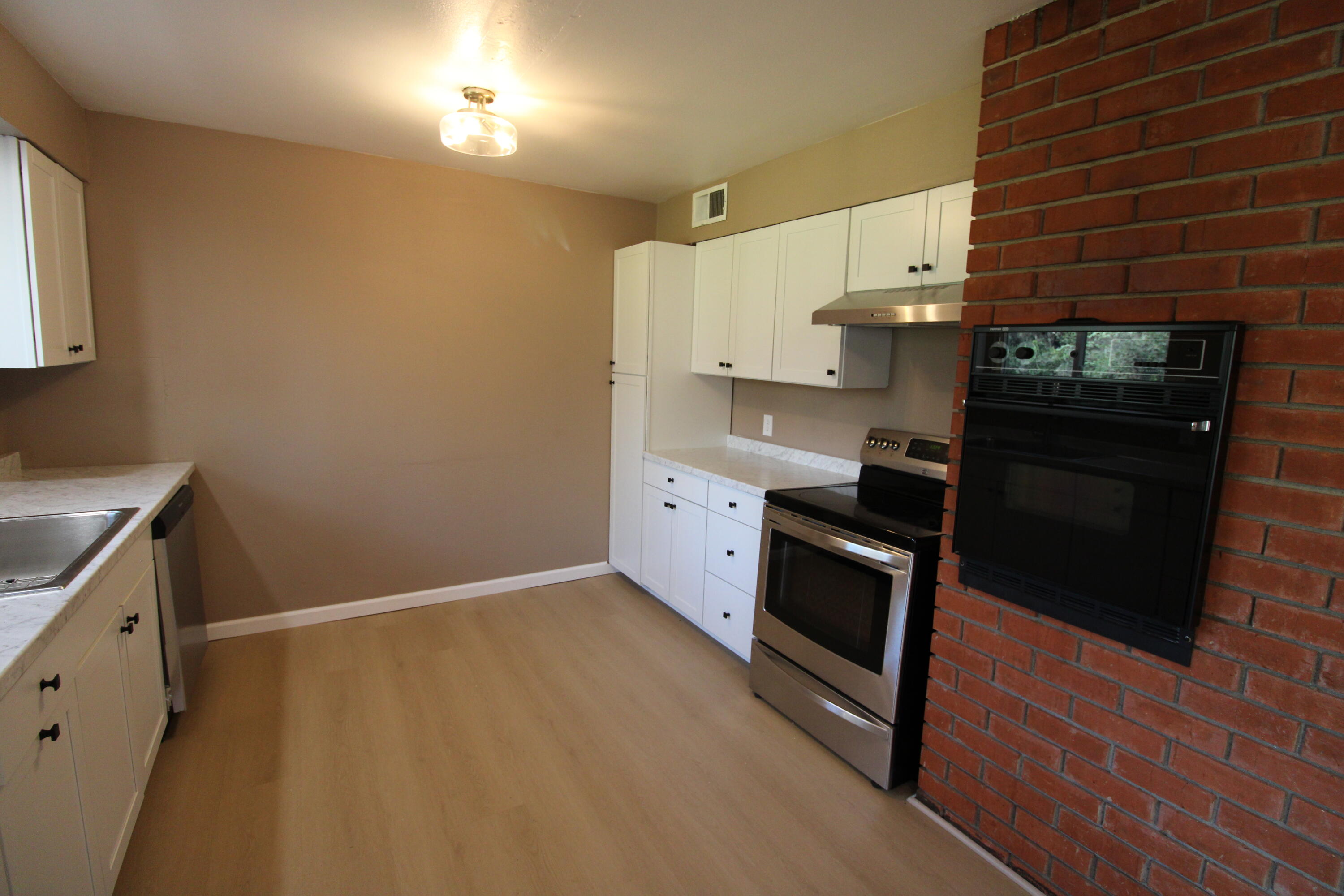 3170 Quartz Hill Road Redding, CA 96003 - Photo 48 of 68 a kitchen with stainless steel appliances a stove a sink and a refrigerator