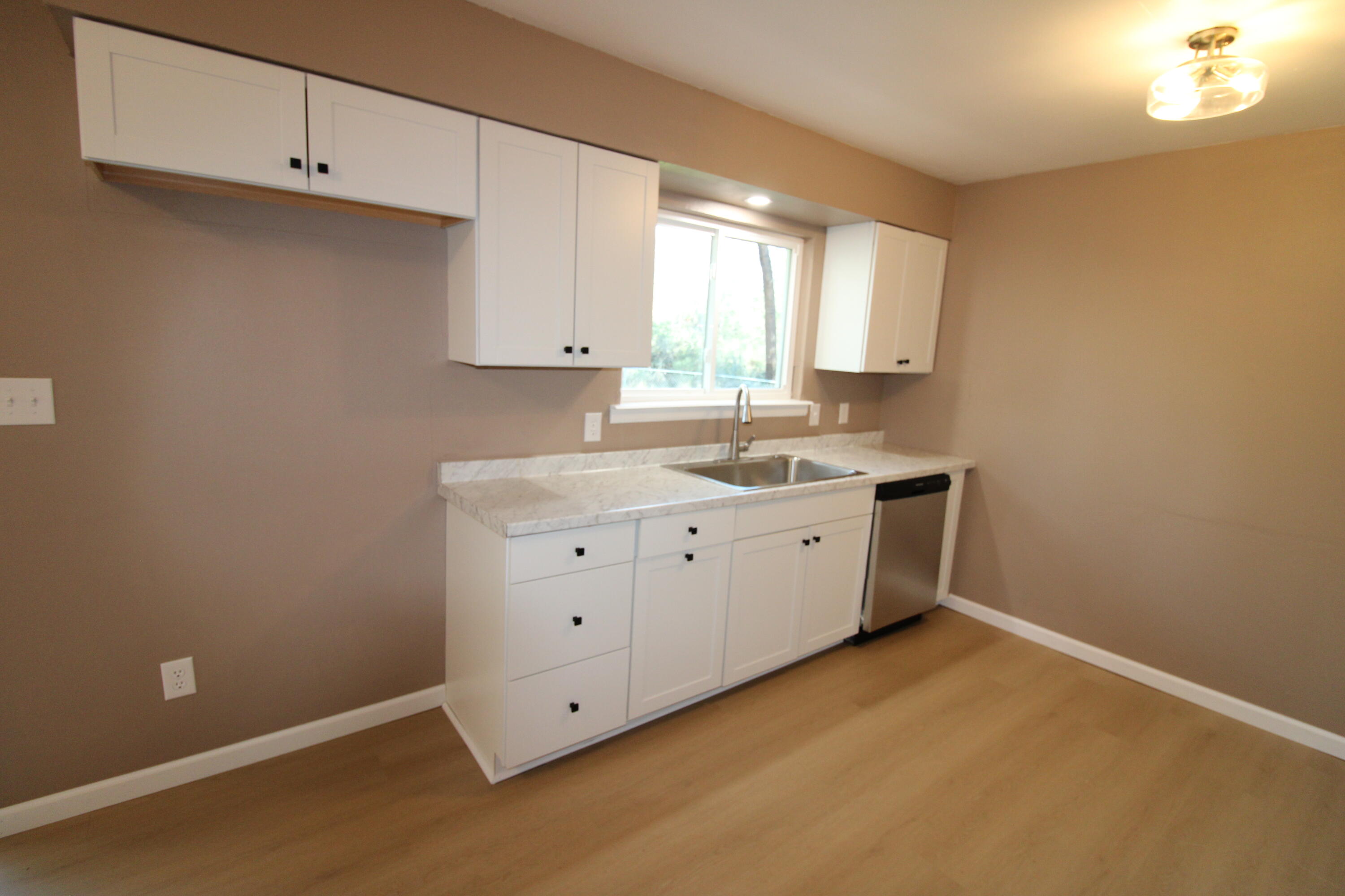 3170 Quartz Hill Road Redding, CA 96003 - Photo 52 of 68 a room with a sink cabinets and utility room