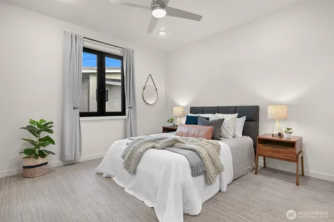 a bedroom with bed and a window