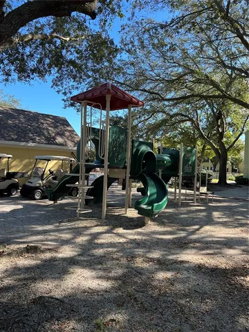a view of a street with cars parked