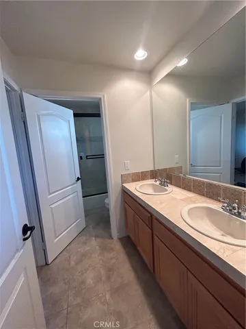 a bathroom with a sink and a large mirror