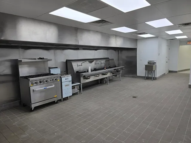 a kitchen with furniture and a fireplace