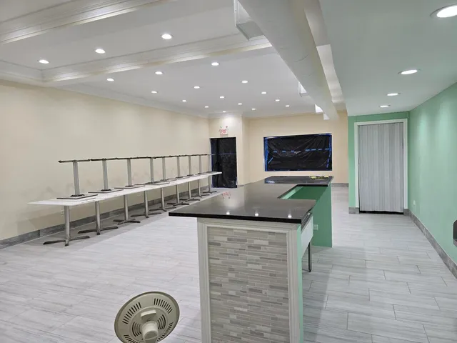 a kitchen with a sink and cabinets