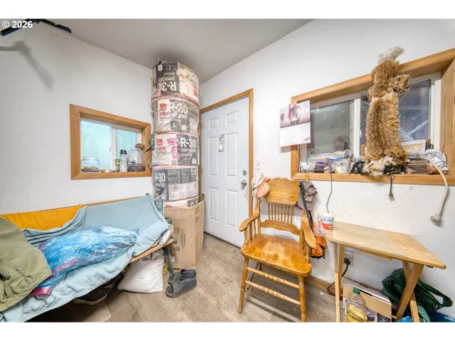 a view of a garden with sitting area