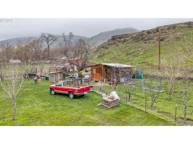 a couple of cars parked in front of a building