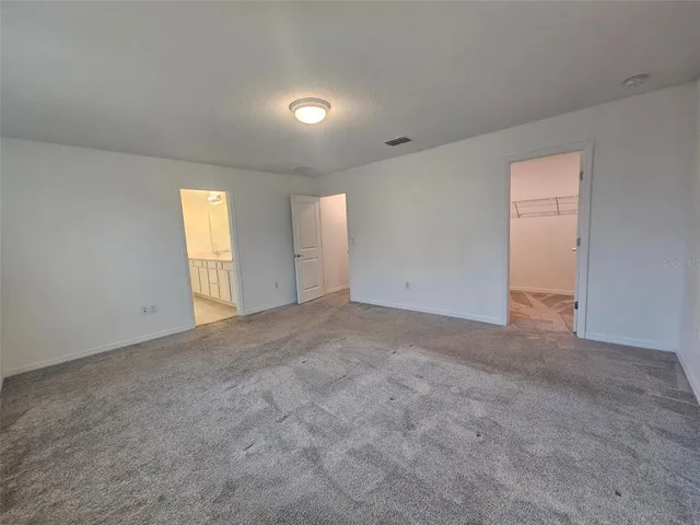 a bathroom with double sink and a mirror