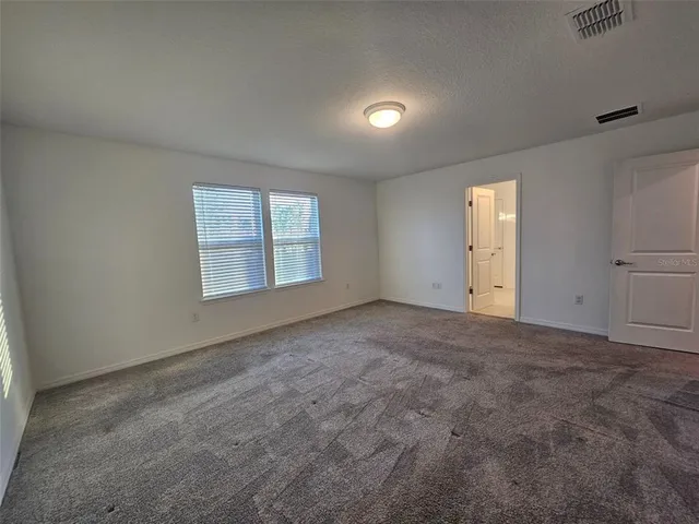 a bathroom with a shower and a sink