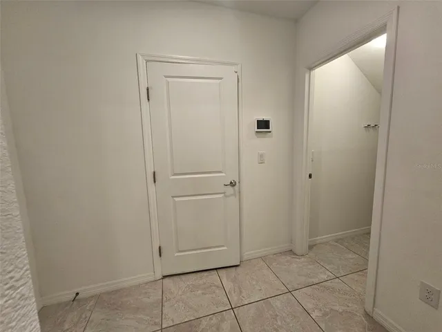 an empty room with a empty space and a window