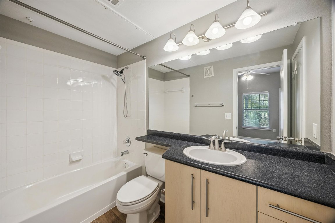11203 Ranch Road 2222, Unit 1504 Austin, TX 78730 - Photo 6 of 10 Full bathroom featuring shower / tub combination, vanity, and a ceiling fan