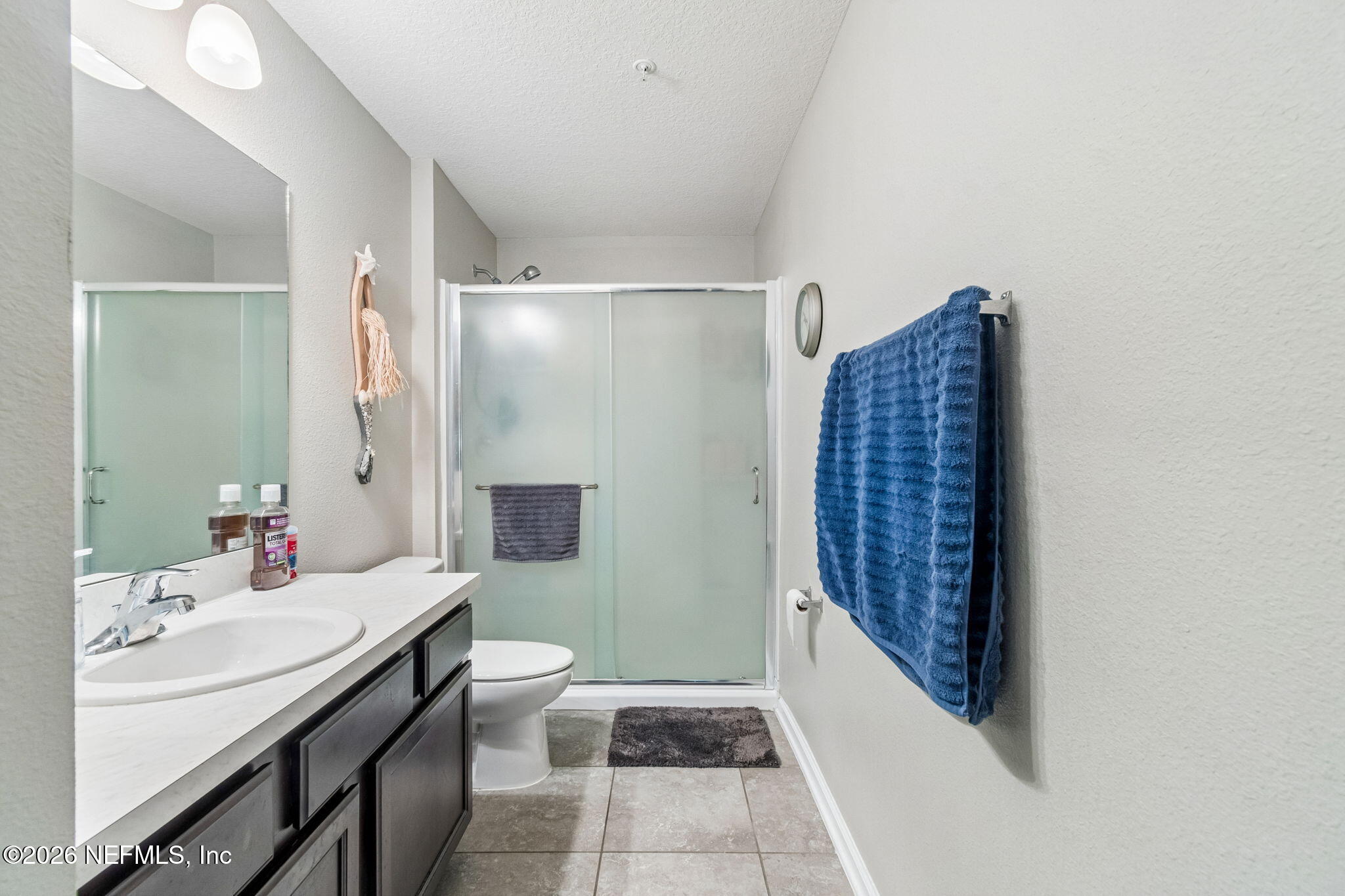 2113 Golden Lake Loop St. Augustine, FL 32084 - Photo 36 of 50 a bathroom with a granite countertop sink a toilet and shower