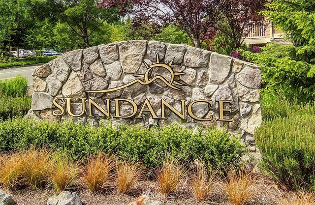 a sign that is on a brick wall