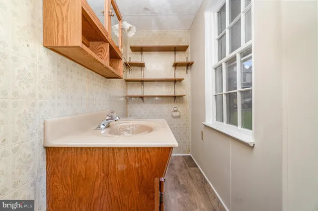a bathroom with a sink and a mirror