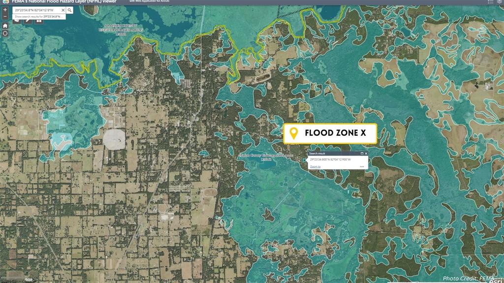 Tbd Tbd Corner Northeast Citra, FL 32113 - Photo 8 of 10 a sign that is sitting on a brick wall